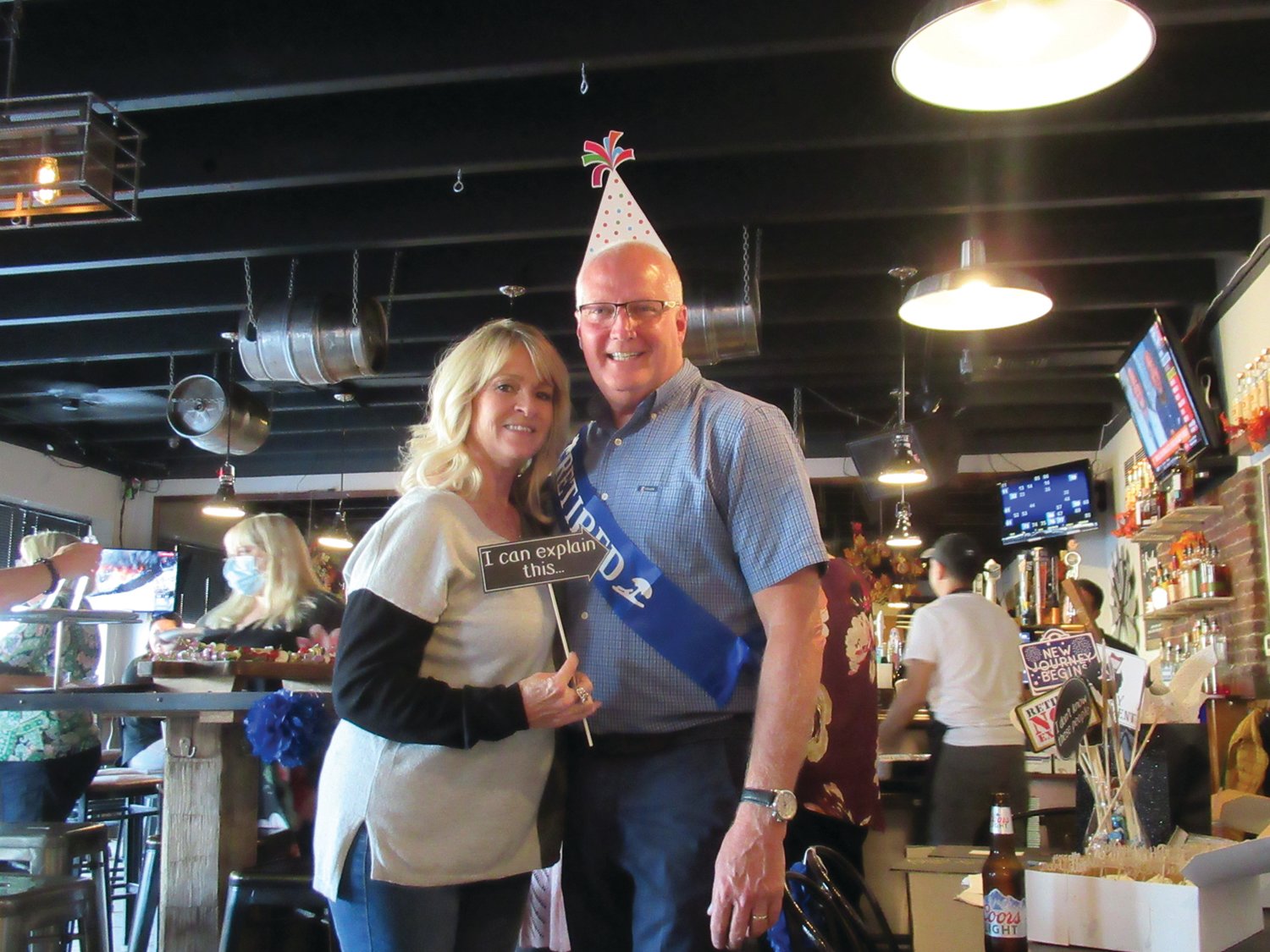 TOP TANDEM: Jerri Cantone, who will succeed Dave Cournoyer upon his retirement last Friday from the Johnston School Department, enjoys a lighter moment with her boss during last Thursday’s retirement party.
